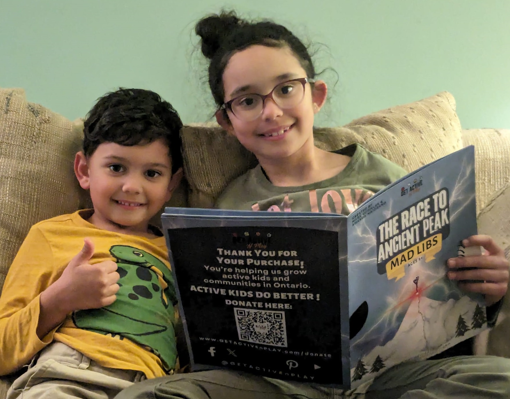 Two children reading a Get Active 'N Play story book together