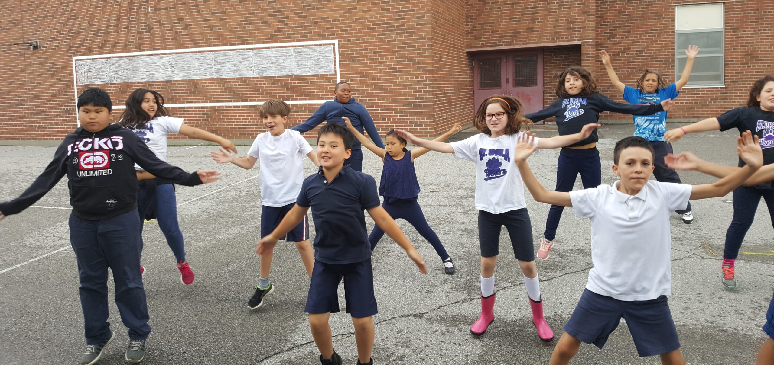 Kids in a Get Active 'N Play in-school program, with a Sportswall behind them