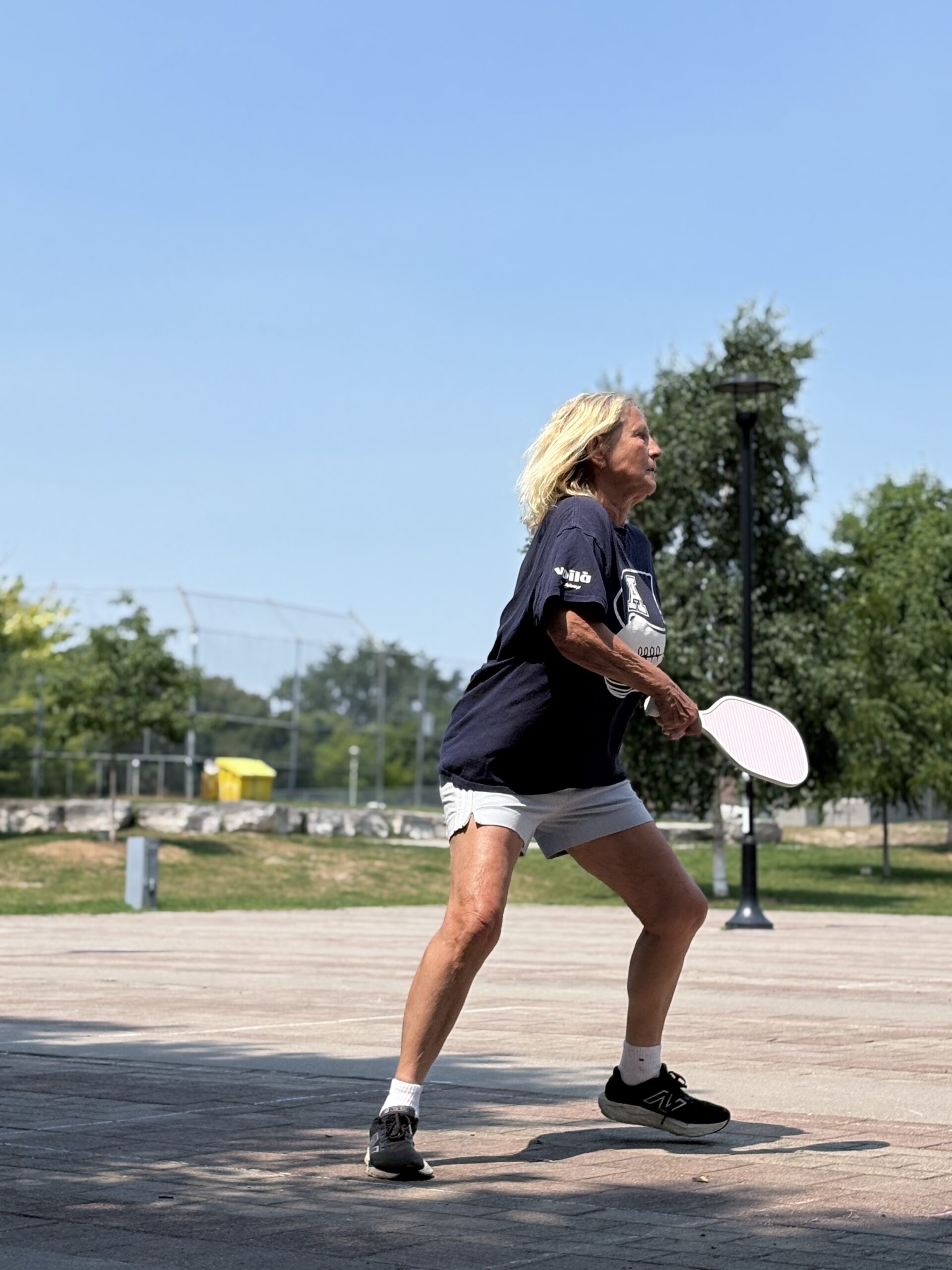 A pickleball player lining up a shot at Sorauren Park