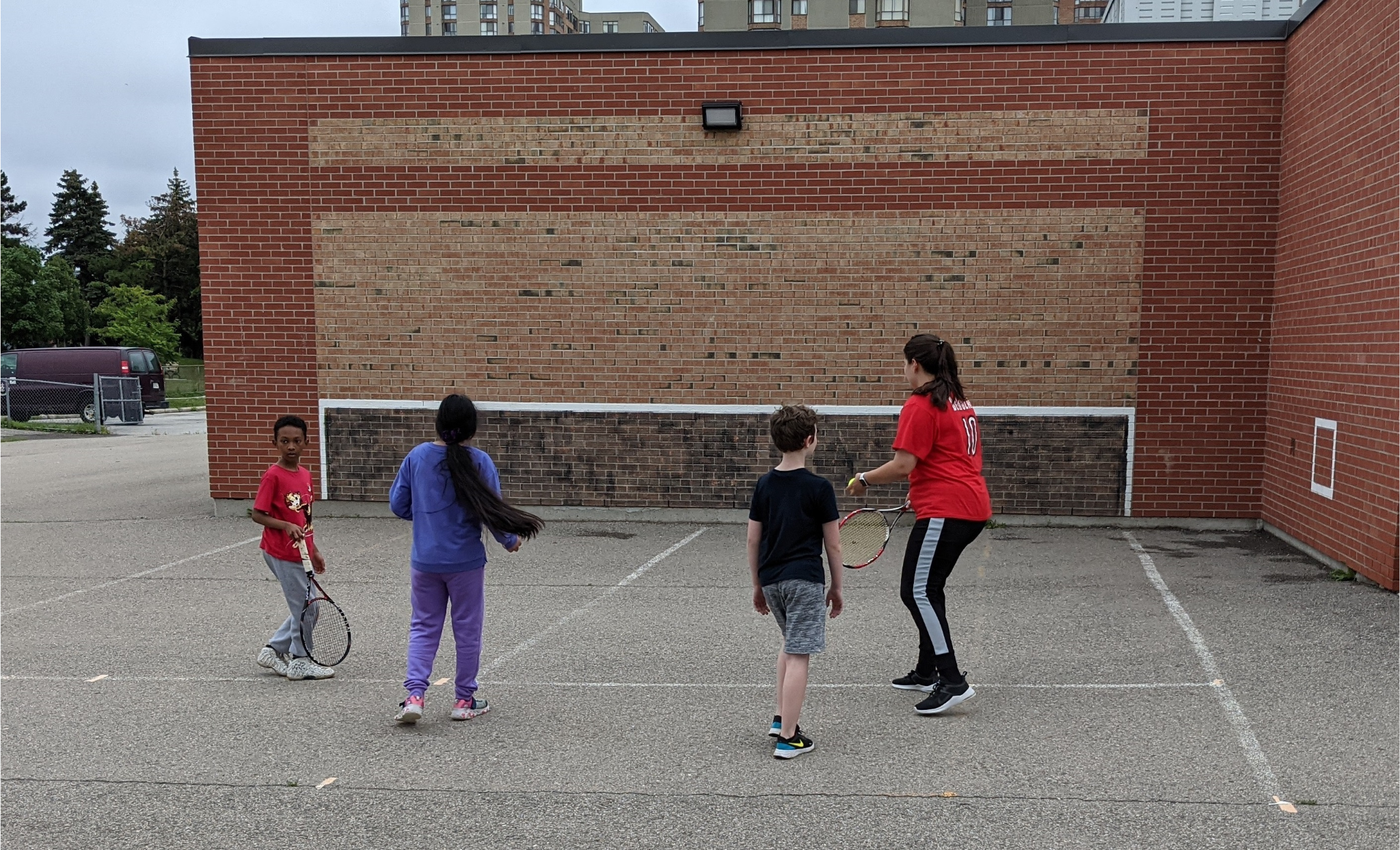 Kids playing on a painted Sportswall at a Scarborough school